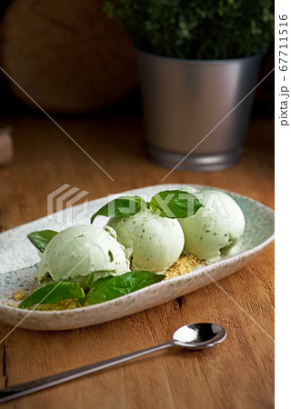 Homemade ice cream from green basil Homemade ice cream from green basil 67711516