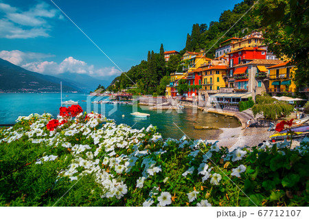 Varenna resort view with anchored boats in harbor, lake Como 67712107