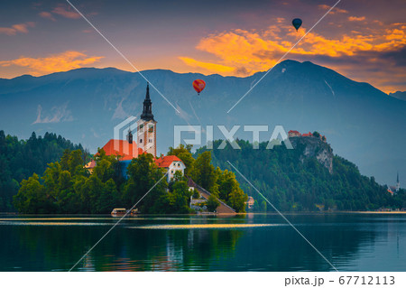 Hot air balloons over the lake Bled at sunrise, Slovenia 67712113