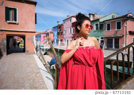 Beautiful young woman in red dress and sunglasses, Beautiful young woman in red dress and sunglasses, 67713192