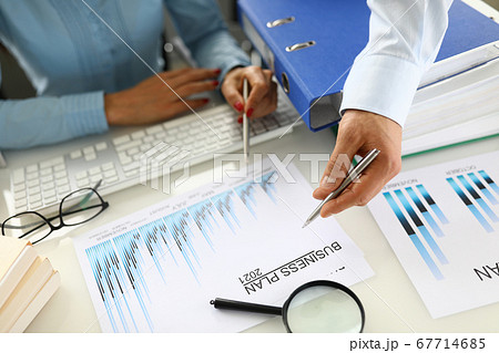 Drawing up and planning a business plan for 2021 closeup. 67714685