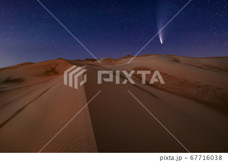 Comet Neowise C/2020 F3 over sand dunes in the Sahara Desert. 67716038