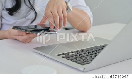 and of woman places a smartphone on top to share a and of woman places a smartphone on top to share a 67716045