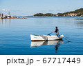 Reflections of a fishing boat at Vela Luka 67717449