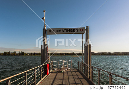 Pier at Ermatingen. Reichenau Island in the background. Lake Constance, Switzerland Pier at Ermatingen. Reichenau Island in the background. Lake Constance, Switzerland 67722442