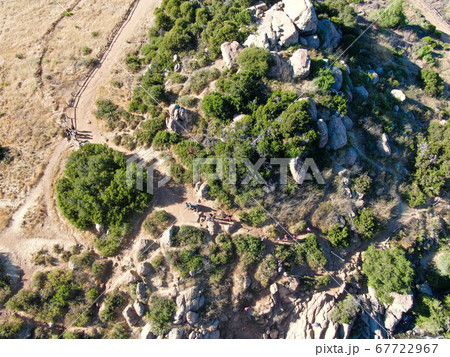 Aerial view of Los Penasquitos Canyon Preserve with tourist and hikers looking at the view, San Diego 67722967