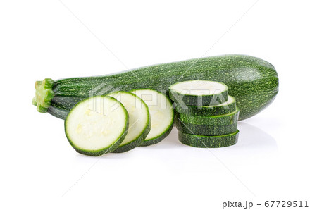 green zucchini with slice on white background 67729511