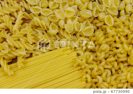 Variety of types and shapes of raw italian pasta Variety of types and shapes of raw italian pasta 67730990