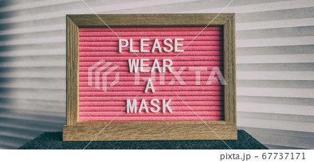 Please wear a mask pink sign at business store entrance message. Obligatory wearing of COVID-19 protection face cover 67737171
