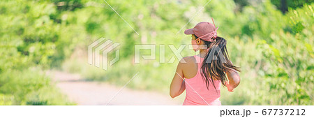 COVID-19 sport mask runner running outdoor wearing protective face cover jogging outside for coronavirus prevention in public. Outdoor summer lifestyle panoramic banner 67737212