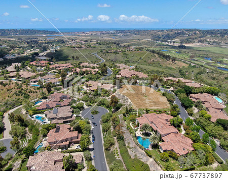 Aerial view of high class neighborhood with big villa in the valley, San Diego 67737897