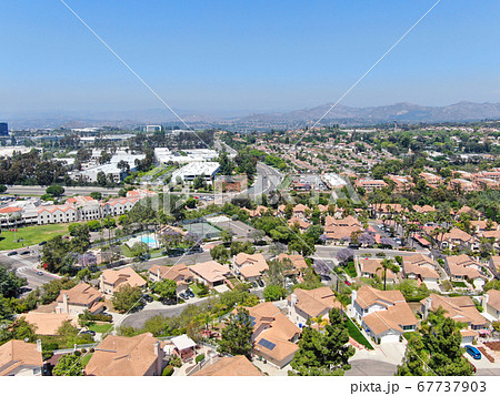 Aerial view of middle class neighborhood street with residential house Aerial view of middle class neighborhood street with residential house 67737903