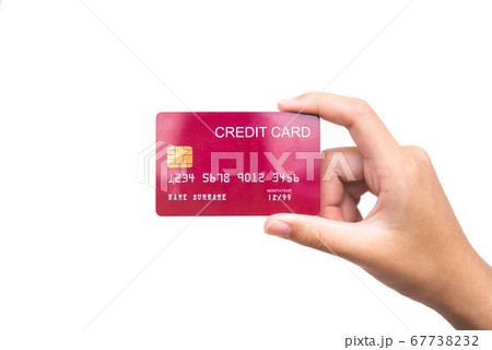 woman's hand holding a credit card on a white woman's hand holding a credit card on a white 67738232