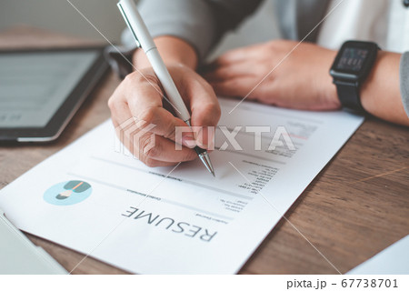 People are filling out their resume on the job 67738701