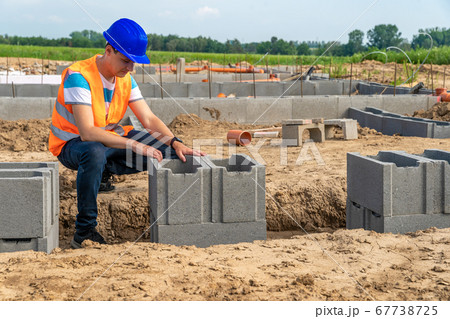 craftsman on the construction of the foundation of the building 67738725