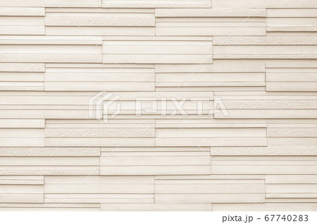 Granite tiled wall detailed pattern texture background in natural light beige brown. 67740283