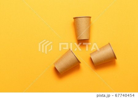 Paper cups on an orange background 67740454