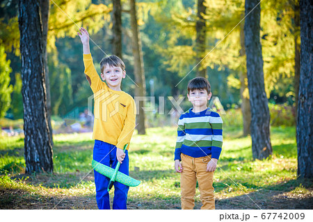 Happy two brother kids playing with toy airplane 67742009