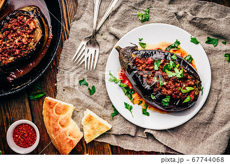 Eggplant stuffed with ground beef and tomatoes Eggplant stuffed with ground beef and tomatoes 67744068