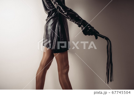 Sensual provocation of a sexy bdsm woman with whip 67745504