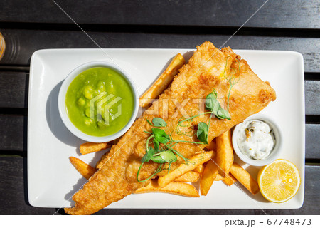 Fish and Chips with peas 67748473