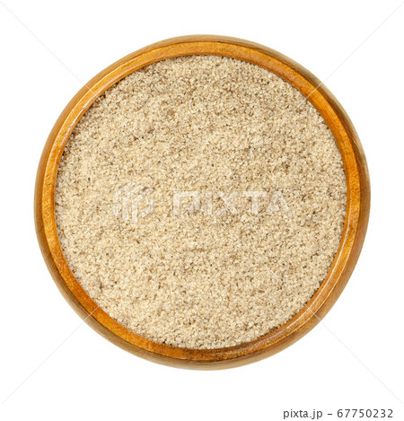 Bourbon vanilla sugar in wooden bowl. Crystal sugar with ground Bourbon vanilla pods, used for baking and to flavor food. Close-up, from above, on white background, isolated, macro food photo. Bourbon vanilla sugar in wooden bowl. Crystal sugar with ground Bourbon vanilla pods, used for baking and to flavor food. Close-up, from above, on white background, isolated, macro food photo. 67750232