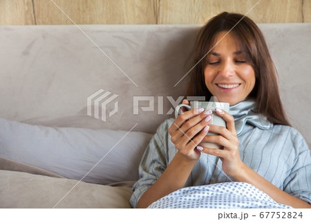 Good morning! Woman woke up in bed. Woman drinking coffee in bed Good morning! Woman woke up in bed. Woman drinking coffee in bed 67752824