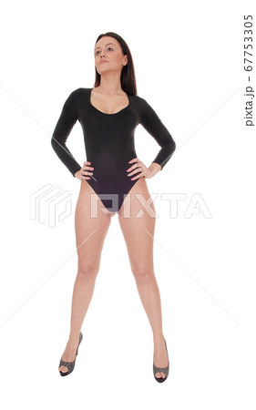 Woman standing in a black body suit from the front 67753305