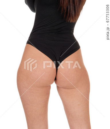 Woman standing from the back in a black body suit 67753306