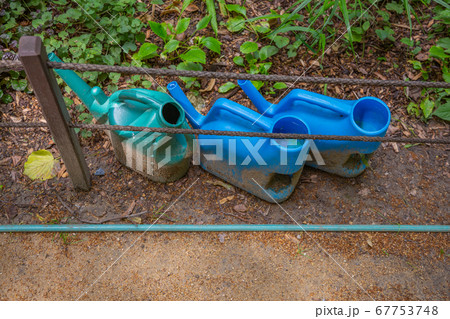 Blue plastic garden watering can 67753748