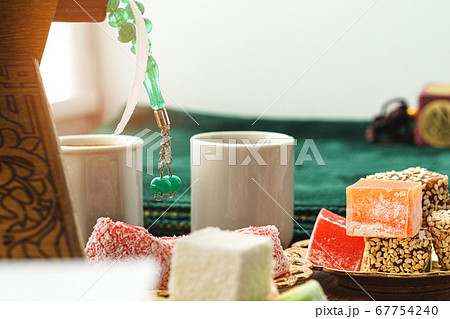 Close up of a little plate with turkish sweets and cup of espresso Close up of a little plate with turkish sweets and cup of espresso 67754240