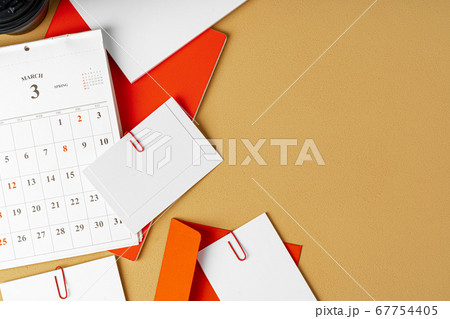 Red and white blank branding paper on beige background Red and white blank branding paper on beige background 67754405