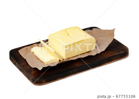 Butter on wooden board isolated on white background Butter on wooden board isolated on white background 67755106