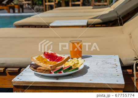 Side view of delicious breakfast at the swimming pool 67755774