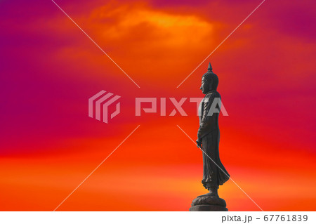 Sunday Buddha and sunset red orange cloud on sky 67761839