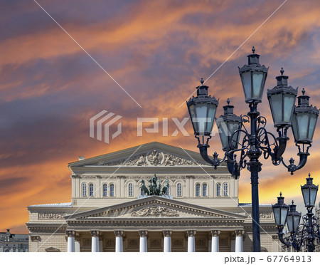 Bolshoi Theatre (Large, Great or Grand Theatre, also spelled Bolshoy) on a beautiful sky with cloud before sunset background, Moscow, Russia 67764913