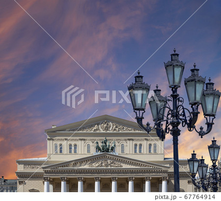Bolshoi Theatre (Large, Great or Grand Theatre, also spelled Bolshoy) on a beautiful sky with cloud before sunset background, Moscow, Russia 67764914