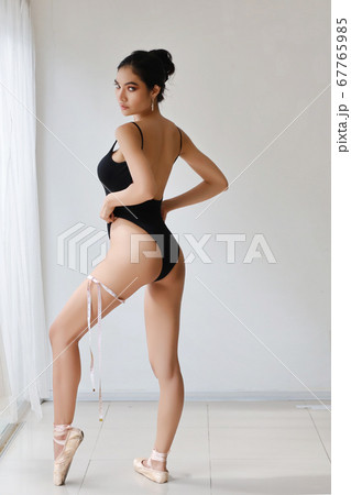 full length healthy and slim woman taking measurements of her body full length healthy and slim woman taking measurements of her body 67765985