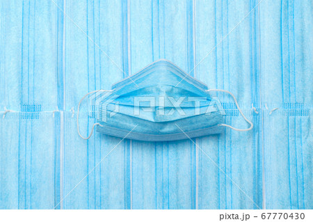 coronavirus COVID-19 pandemic concept - background made of antiviral surgical protective medical masks for protection against corona virus coronavirus COVID-19 pandemic concept - background made of antiviral surgical protective medical masks for protection against corona virus 67770430