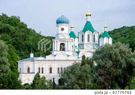 christian church in a green forest without people 67770783
