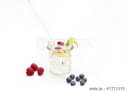 Gin and tonic in a glass jar with lime, Gin and tonic in a glass jar with lime, 67771355