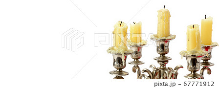 Old candlestick with candles isolated on white . Old candlestick with candles isolated on white . 67771912
