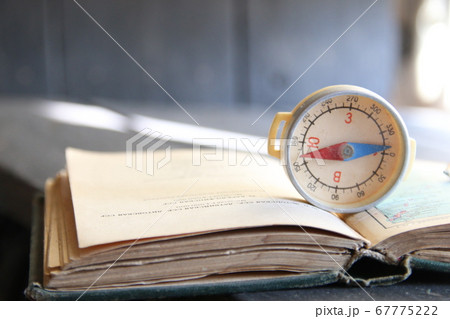 Magnetic compass on world map. Adventure, discovery concept. Magnetic compass on world map. Adventure, discovery concept. 67775222
