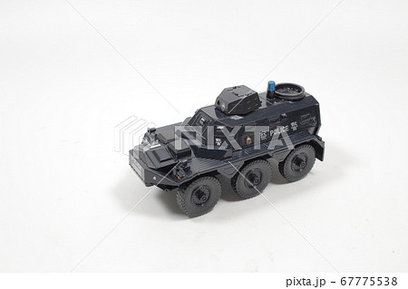 Scale police car model with figure at the white Scale police car model with figure at the white 67775538