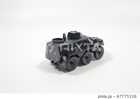 Scale police car model with figure at the white Scale police car model with figure at the white 67775539