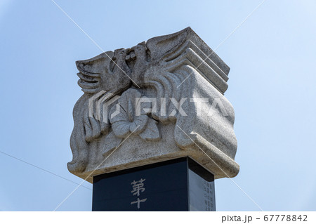 GIMHAE, SOUTH KOREA - JUNE 18, 2017 : Figure head of the ancient Chinese stone inscription pillar craving into phoenix image locate on the street in Gimhae, Gyeongsangnam-do, South Korea. 67778842