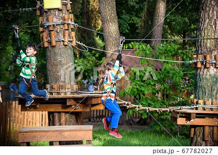 Two little boys playing together and having fun. Two little boys playing together and having fun. 67782027