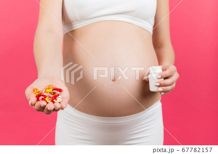 Close up of a bottle and heap of pills in pregnant 67782157