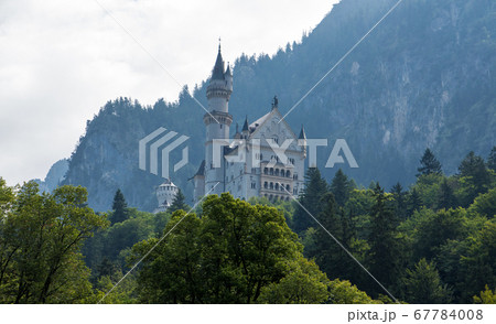 Neuschwanstein castle in bavaria, germany cloudy mood mountain Neuschwanstein castle in bavaria, germany cloudy mood mountain 67784008
