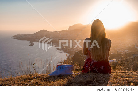 Sunset view person hiking madeira miradouro looking over bay of Funchal outdoor traveling concept 67784047